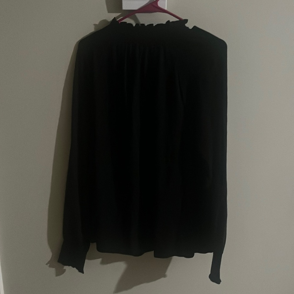 Chicos size, extra large. Black turtleneck-ish never worn very soft.